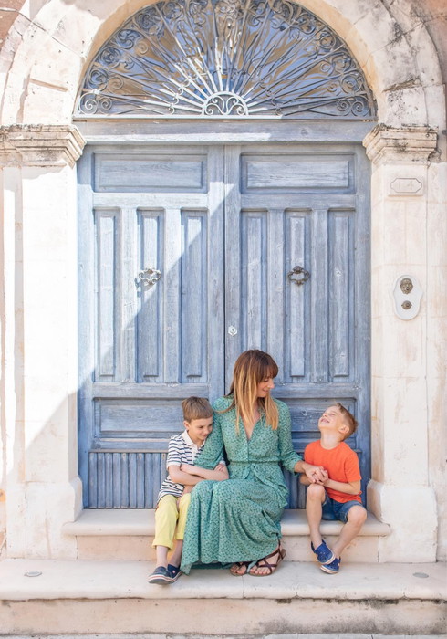 hannah sitting at a door